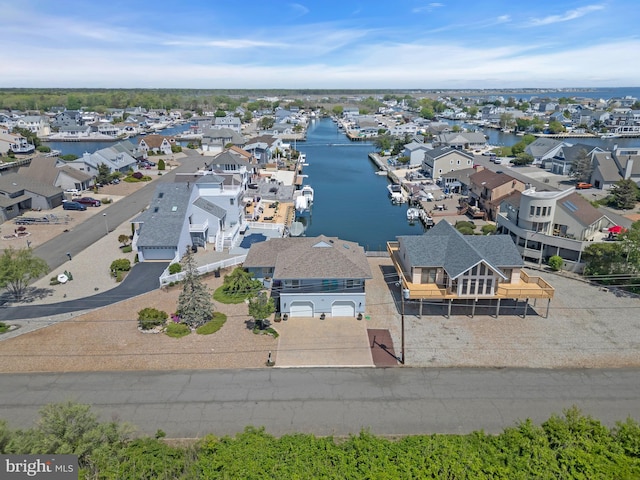 aerial perspective of suburban area with a nearby body of water
