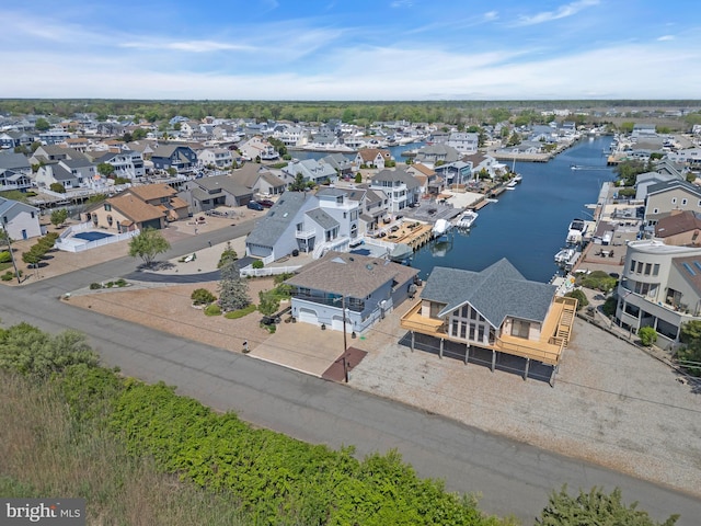 aerial perspective of suburban area with a large body of water