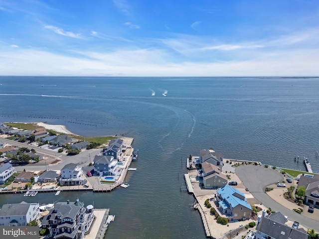aerial view of residential area featuring a nearby body of water