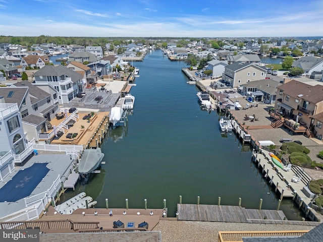 aerial view of residential area with a nearby body of water