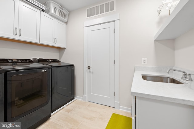 23650 Havelock Walk Ter Unit 303, Ashburn, VA 20148 - laundry room with cabinet space, separate washer and dryer, and baseboards