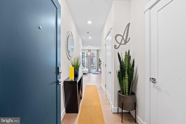 23650 Havelock Walk Ter Unit 303, Ashburn, VA 20148 - hallway with recessed lighting, baseboards, and light wood-style floors