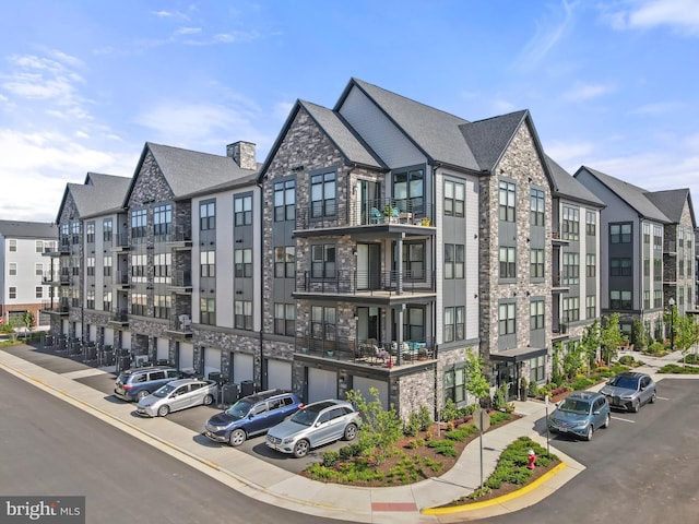 23650 Havelock Walk Ter Unit 303, Ashburn, VA 20148 - view of property featuring an attached garage