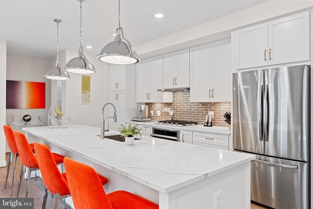 23650 Havelock Walk Ter Unit 303, Ashburn, VA 20148 - kitchen with appliances with stainless steel finishes, a sink, recessed lighting, white cabinets, and backsplash