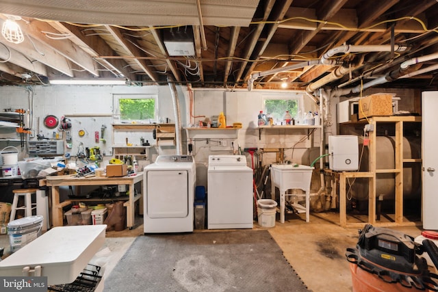 below grade area with independent washer and dryer and a sink