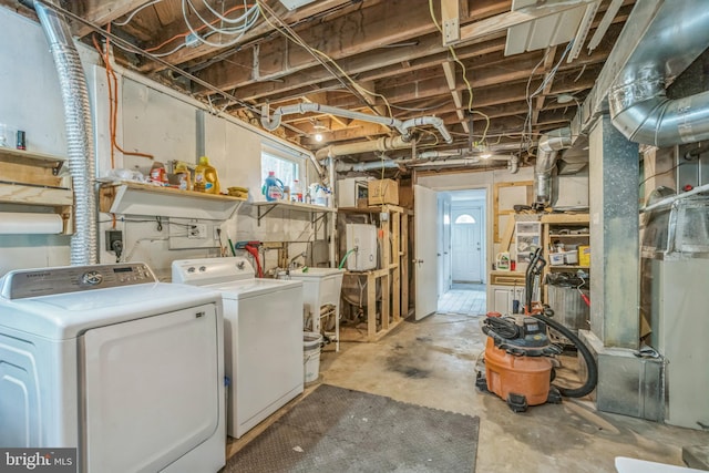 below grade area featuring independent washer and dryer and a sink