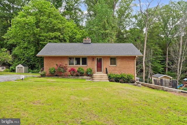 view of front of house featuring brick siding, a storage shed, roof with shingles, and a chimney