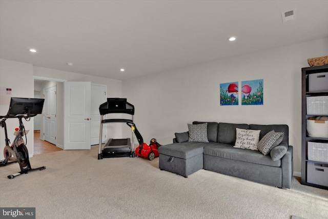 workout room with light carpet, recessed lighting, and baseboards