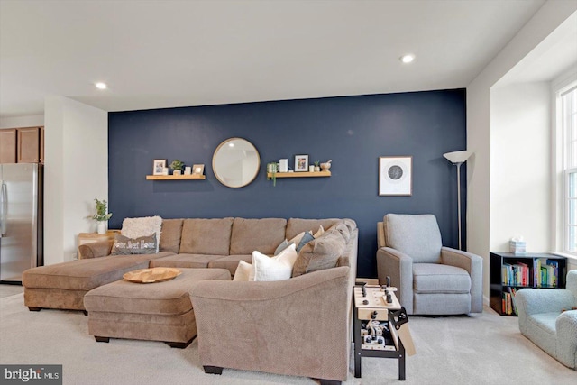 carpeted living area with recessed lighting