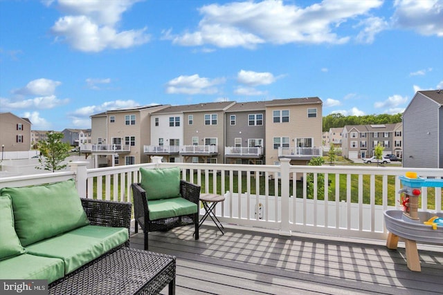 deck with a residential view and outdoor lounge area