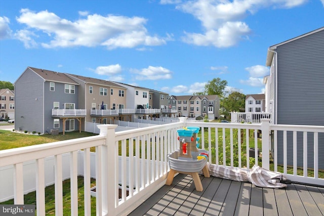 wooden terrace with a residential view