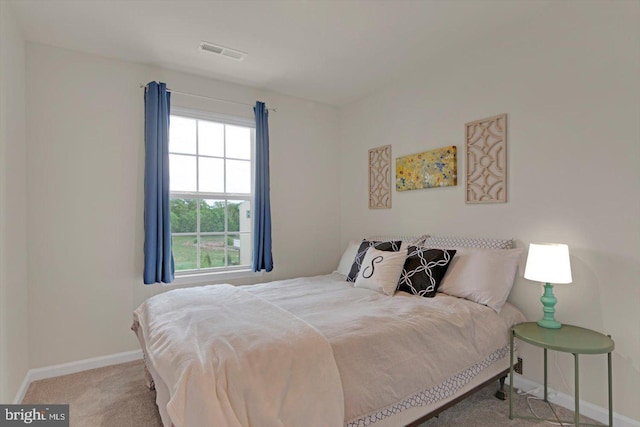 bedroom featuring baseboards and carpet floors