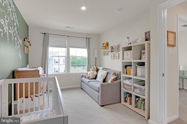 carpeted bedroom featuring baseboards and recessed lighting