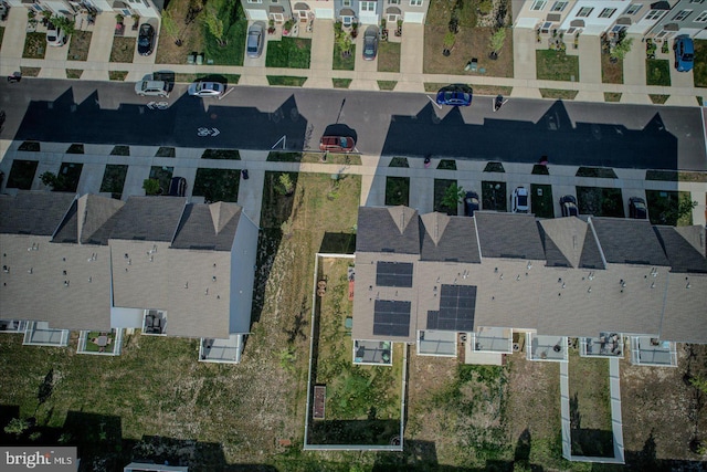 aerial view of property and surrounding area with nearby suburban area