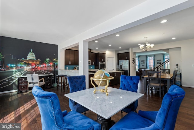 dining room with a chandelier, dark wood-type flooring, and recessed lighting