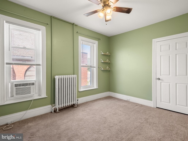 556 W Walnut St, Pottstown, PA 19464 - empty room with radiator heating unit, carpet flooring, cooling unit, a ceiling fan, and baseboards