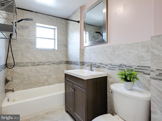 556 W Walnut St, Pottstown, PA 19464 - bathroom featuring tile walls, toilet, tub / shower combination, and vanity