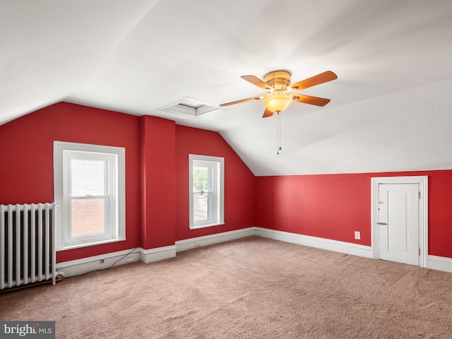 556 W Walnut St, Pottstown, PA 19464 - additional living space with radiator, lofted ceiling, carpet floors, attic access, and a ceiling fan