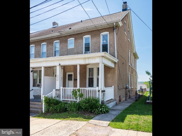 556 W Walnut St, Pottstown, PA 19464 - view of property featuring a chimney and covered porch