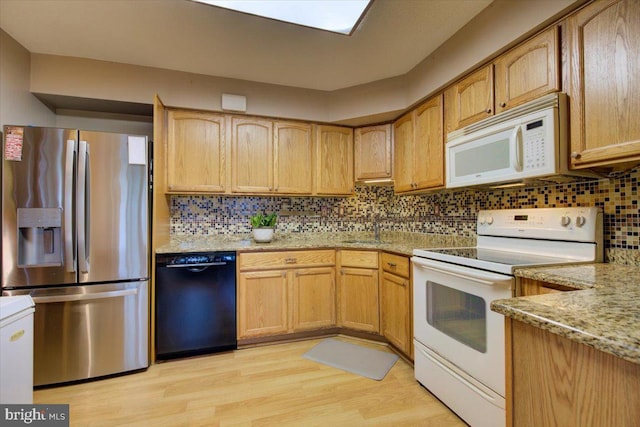 102 Harvest Ln Unit 207, Phoenixville, PA 19460 - kitchen with white appliances, light wood finished floors, light stone countertops, decorative backsplash, and a sink