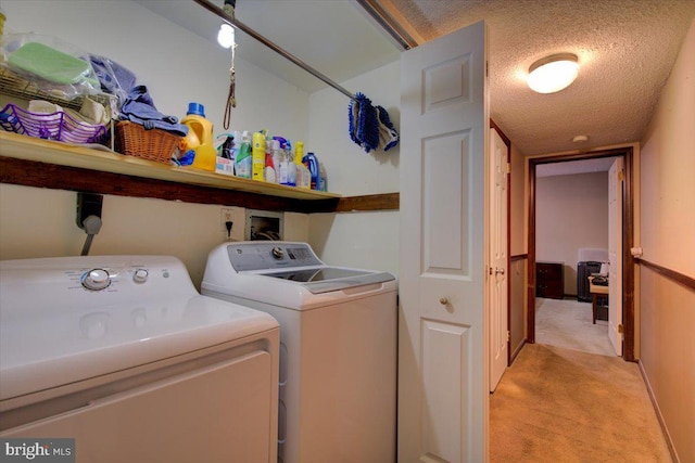 102 Harvest Ln Unit 207, Phoenixville, PA 19460 - washroom featuring washing machine and dryer, light colored carpet, and a textured ceiling