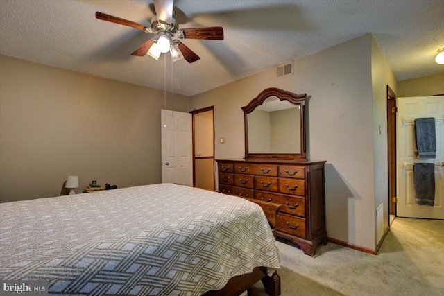 102 Harvest Ln Unit 207, Phoenixville, PA 19460 - bedroom with light carpet, a textured ceiling, baseboards, and a ceiling fan