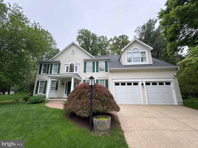 7071 Garden Walk, Columbia, MD 21044 - colonial inspired home with concrete driveway, a front lawn, a garage, a porch, and a shingled roof