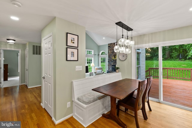 7071 Garden Walk, Columbia, MD 21044 - dining area featuring wood finished floors, lofted ceiling, baseboards, and recessed lighting