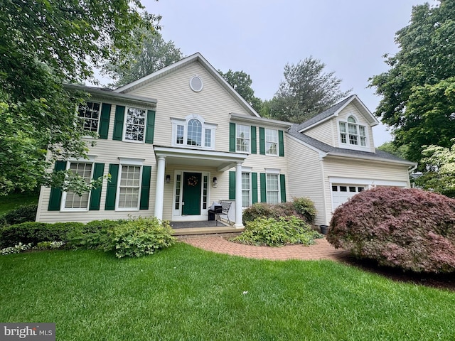 7071 Garden Walk, Columbia, MD 21044 - view of front of property with a front lawn and a garage