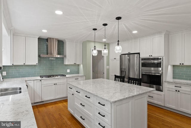 7071 Garden Walk, Columbia, MD 21044 - kitchen with wall chimney exhaust hood, stainless steel appliances, a sink, decorative backsplash, and white cabinets