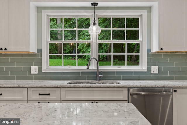 7071 Garden Walk, Columbia, MD 21044 - kitchen featuring stainless steel dishwasher, a sink, white cabinets, and backsplash