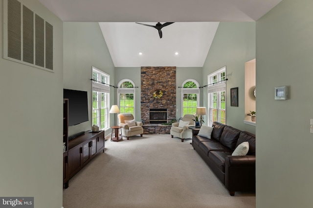 7071 Garden Walk, Columbia, MD 21044 - living area with high vaulted ceiling, light colored carpet, plenty of natural light, and a stone fireplace