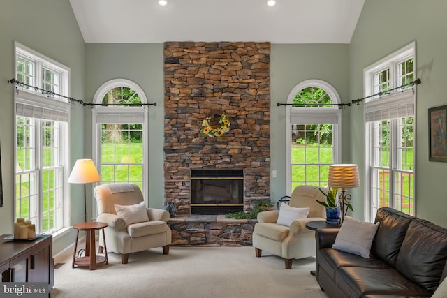 7071 Garden Walk, Columbia, MD 21044 - living area featuring carpet flooring, high vaulted ceiling, and a stone fireplace