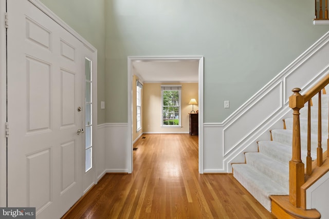 7071 Garden Walk, Columbia, MD 21044 - entrance foyer with wood finished floors, stairway, and baseboards