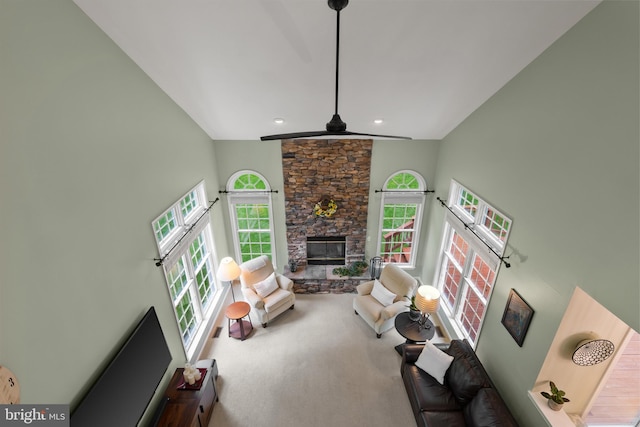 7071 Garden Walk, Columbia, MD 21044 - carpeted living room with healthy amount of natural light, high vaulted ceiling, a fireplace, recessed lighting, and a ceiling fan