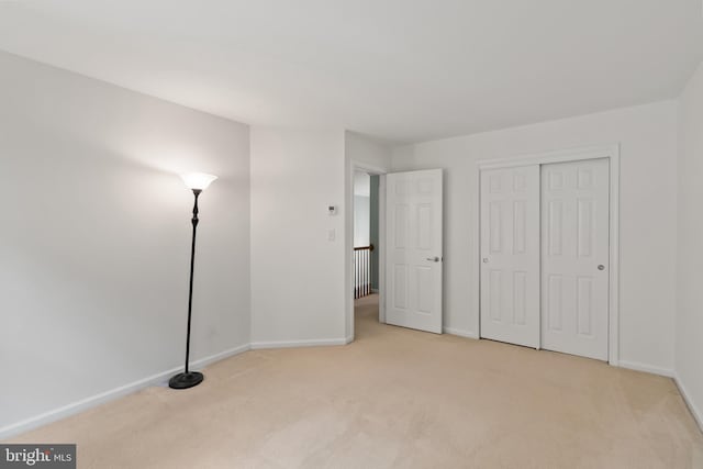 7071 Garden Walk, Columbia, MD 21044 - unfurnished bedroom with carpet flooring, baseboards, and a closet