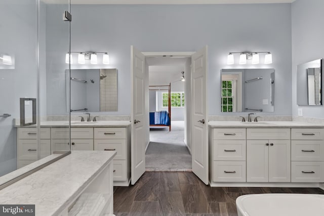 7071 Garden Walk, Columbia, MD 21044 - ensuite bathroom with two vanities, a shower, and a freestanding bath