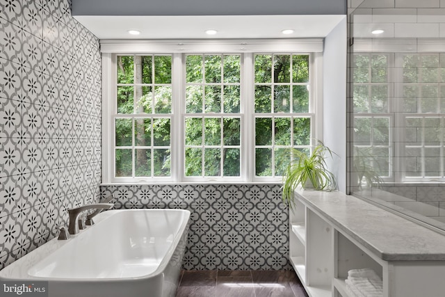 7071 Garden Walk, Columbia, MD 21044 - bathroom featuring a freestanding bath, healthy amount of natural light, tile walls, and recessed lighting