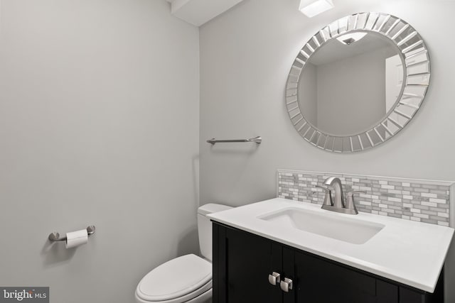 7071 Garden Walk, Columbia, MD 21044 - half bathroom with toilet, vanity, and backsplash