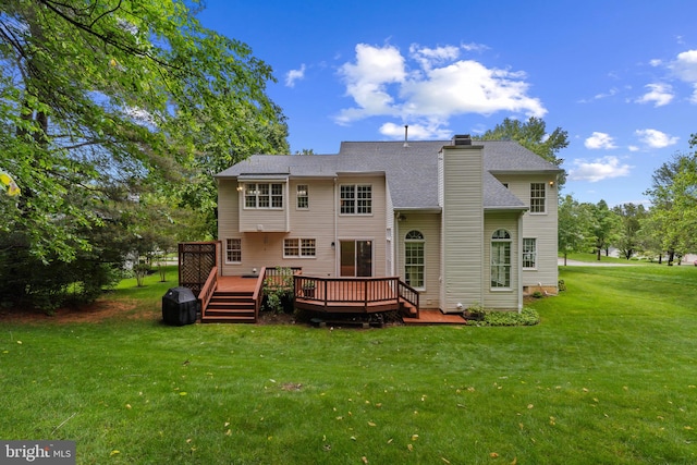 7071 Garden Walk, Columbia, MD 21044 - back of property featuring a lawn, a deck, a chimney, and roof with shingles