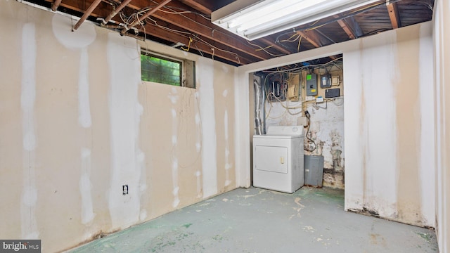 basement featuring washer / dryer and electric panel