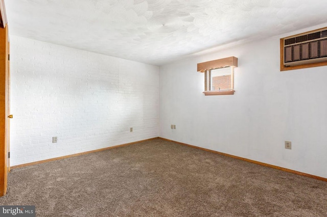 449 Carlisle St, Hanover, PA 17331 - empty room featuring carpet flooring, baseboards, and a wall mounted air conditioner