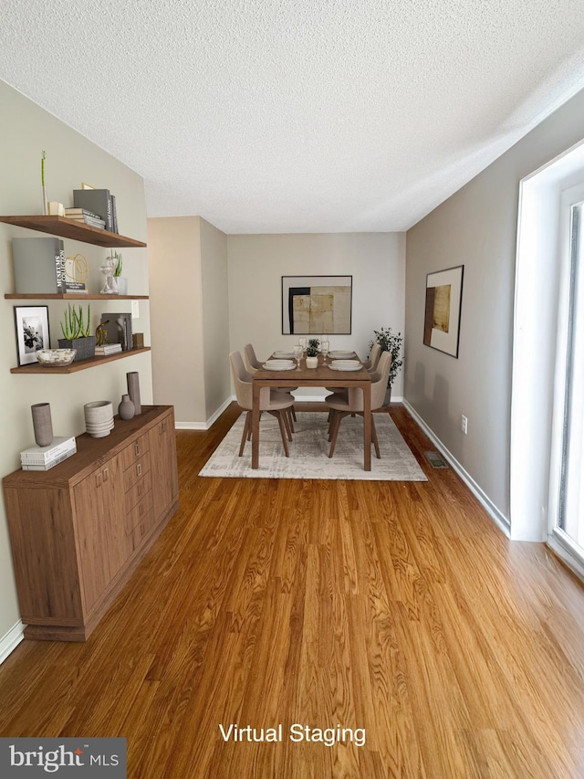7 E Hart St, Winchester, VA 22601 - home office with light wood-style floors, a textured ceiling, and baseboards