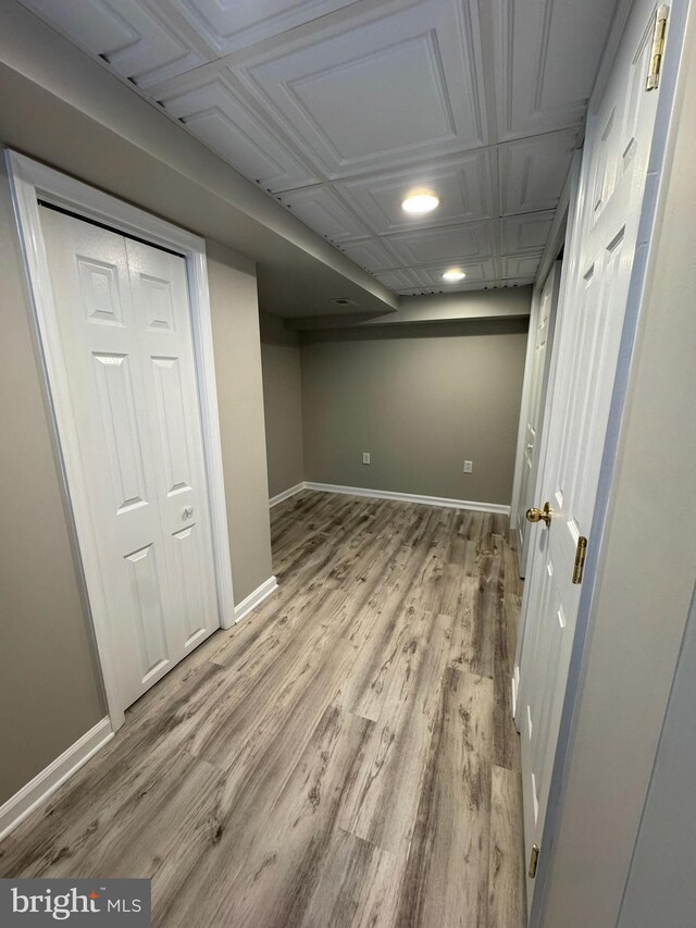 7 E Hart St, Winchester, VA 22601 - finished below grade area featuring light wood-type flooring, baseboards, an ornate ceiling, and recessed lighting