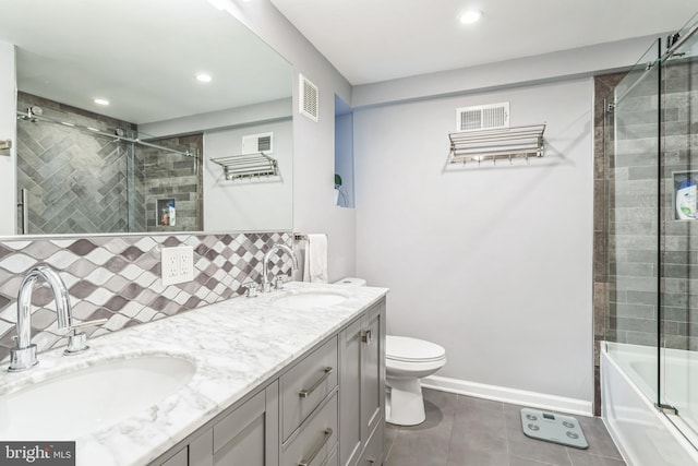 1153 N Hancock St, Philadelphia, PA 19123 - bathroom featuring double vanity, tile patterned flooring, toilet, recessed lighting, and baseboards