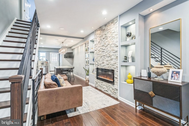 1153 N Hancock St, Philadelphia, PA 19123 - living area with stairway, wood-type flooring, baseboards, a stone fireplace, and recessed lighting