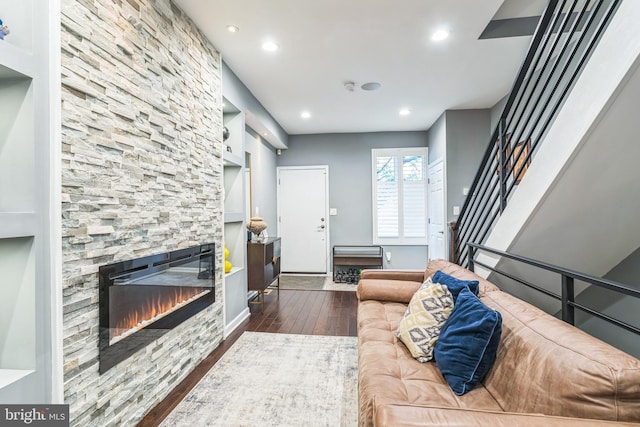 1153 N Hancock St, Philadelphia, PA 19123 - living area featuring a fireplace, dark wood-type flooring, recessed lighting, built in shelves, and stairs