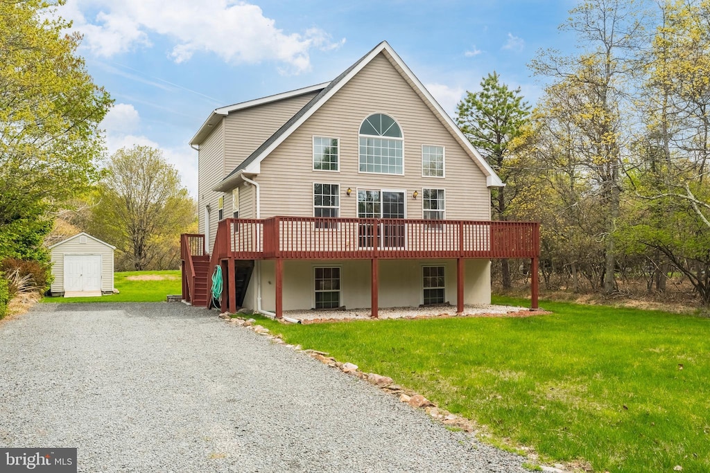 187 Maccauley Rd, Albrightsville, PA 18210 - rear view of property featuring a storage shed, a deck, an outbuilding, a yard, and driveway