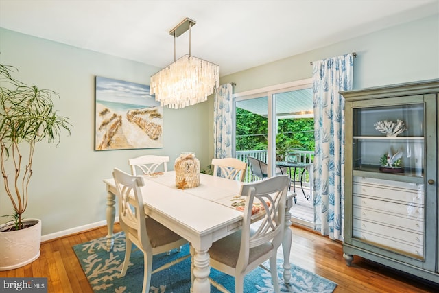 7912 Glengary Ct, Glen Burnie, MD 21061 - dining area with a chandelier, hardwood / wood-style floors, and baseboards