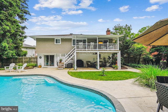 7912 Glengary Ct, Glen Burnie, MD 21061 - back of house featuring a patio area, stairs, and a chimney
